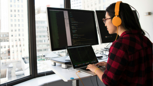 woman at standing desk on laptop